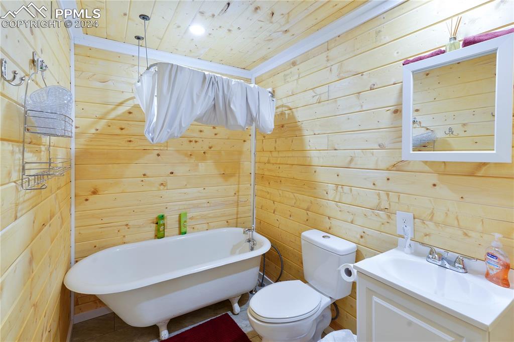 48 Angel Road Rye, CO 81069 - Photo 21 of 25 a bathroom with a white toilet sitting next to a bathroom sink and a shower