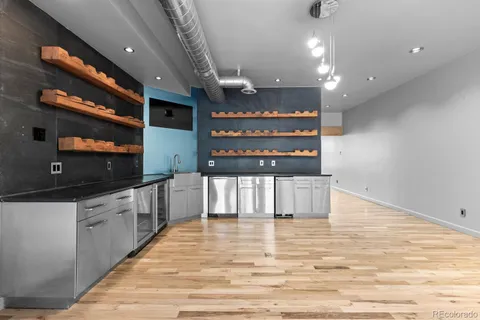 a view of a a dining room with furniture window and wooden floor