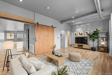 a view of a livingroom with wooden floor
