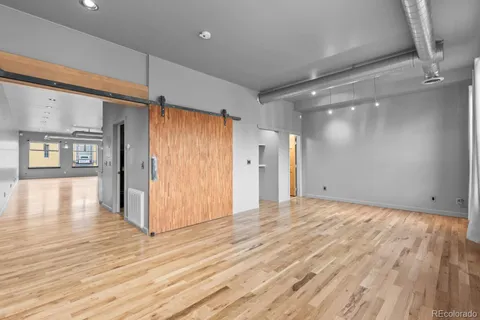 a bathroom with a sink a toilet and a shower