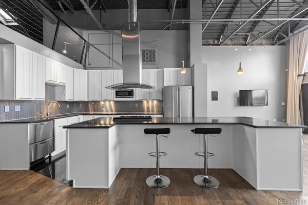 a bathroom with a double vanity sink toilet and shower