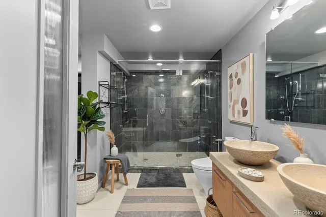 a white bath tub sitting next to a white toilet