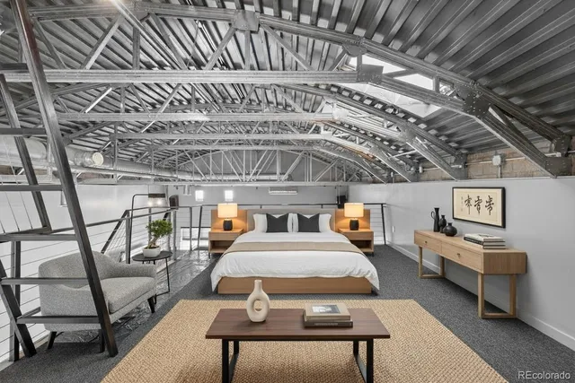 a roof deck with a table and chairs