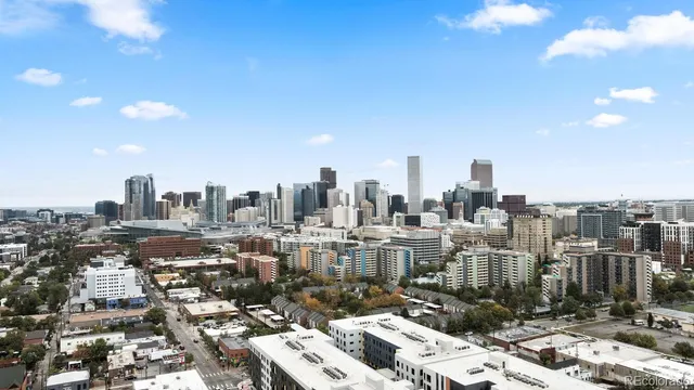 a view of a patio with a table and chairs and potted plants