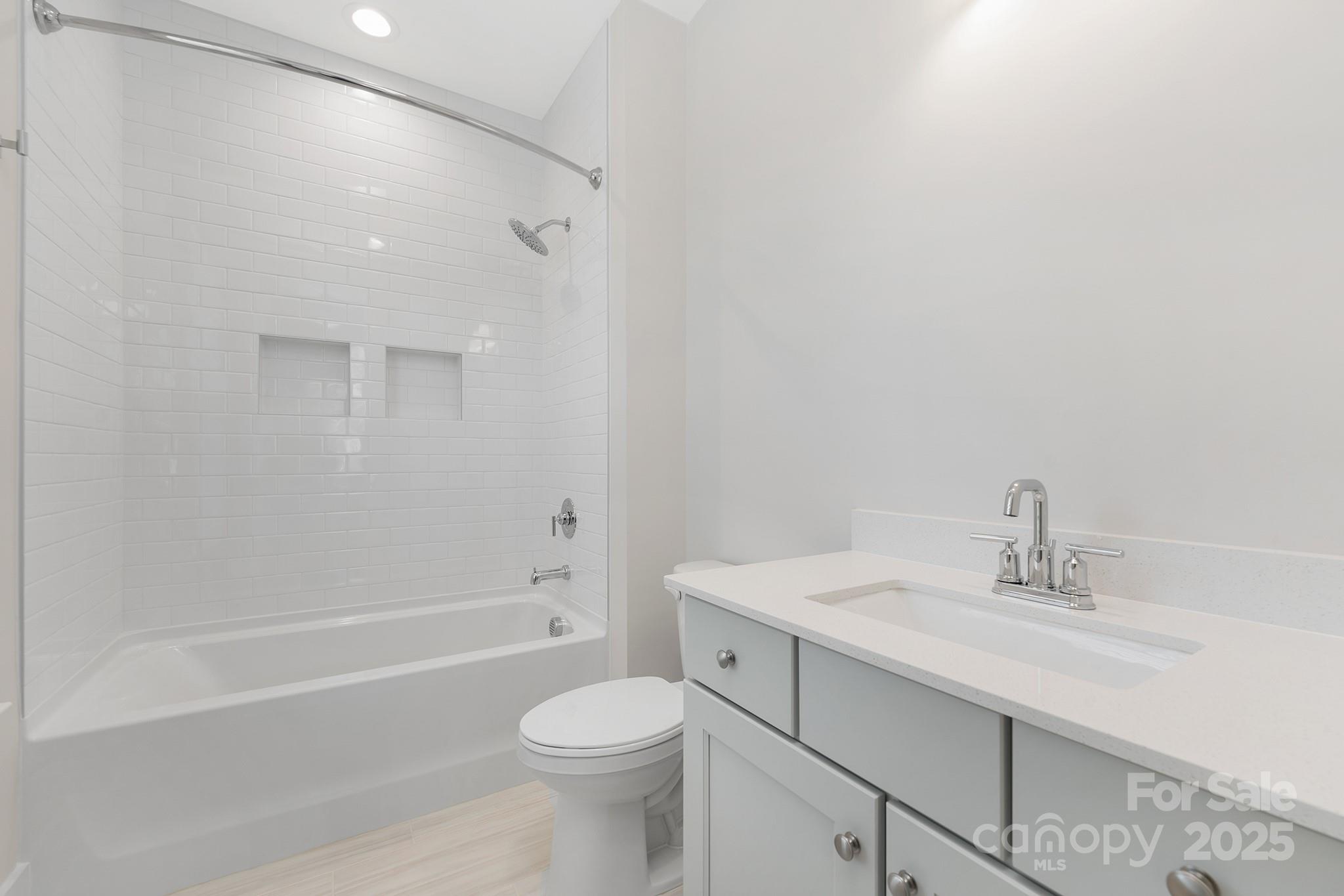 109 Seldon Drive Charlotte, NC 28216 - Photo 27 of 35 a bathroom with a sink a toilet and shower