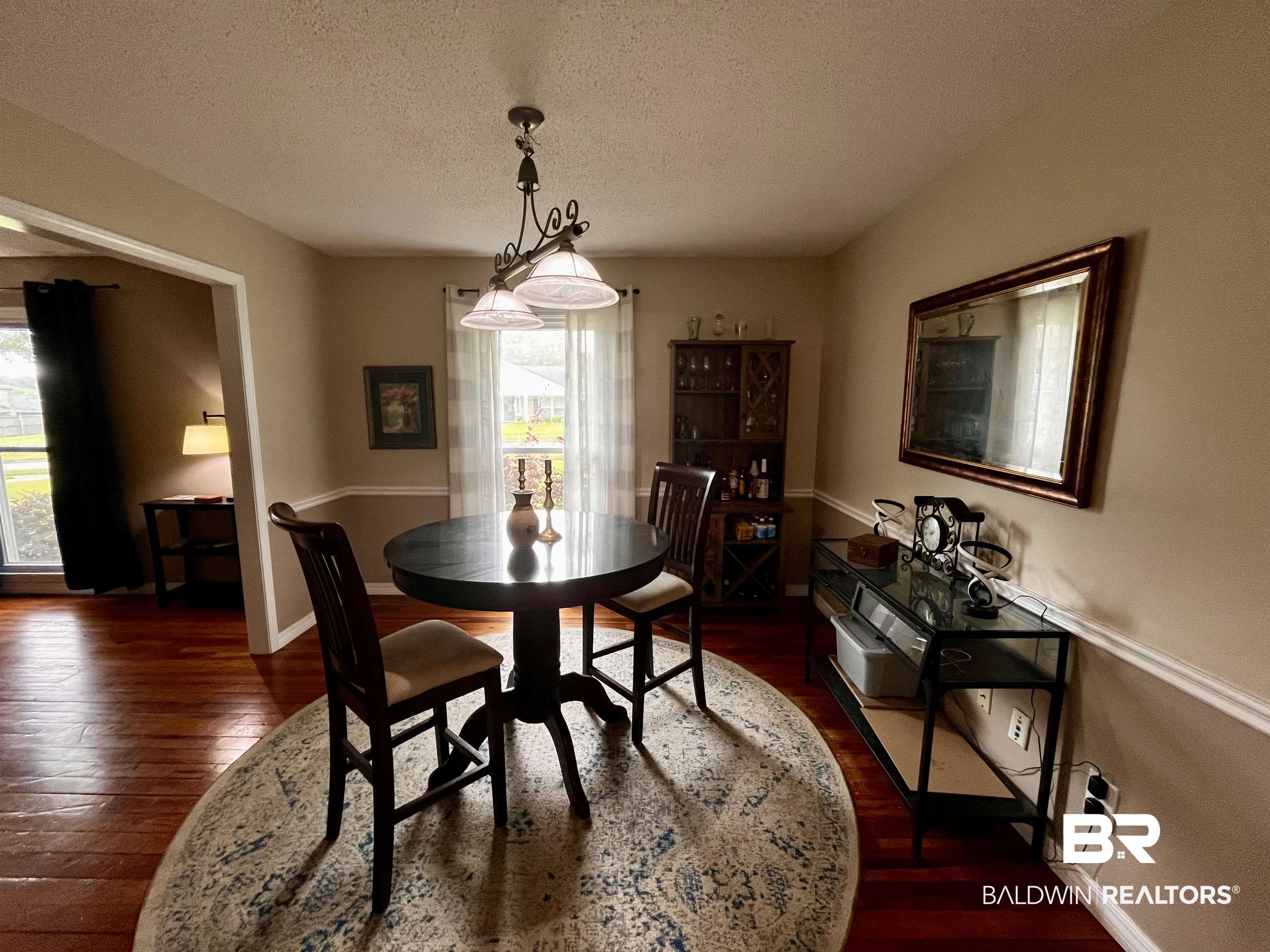 6429 Pinehurst Run Mobile, AL 36608 - Photo 5 of 15 Hardwood-style flooring throughout, with a decorative ceiling light fixture