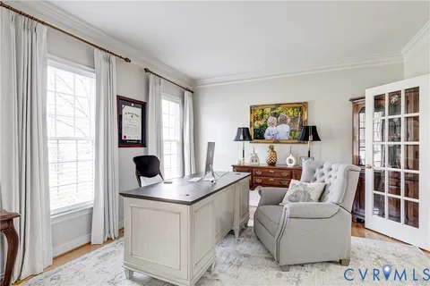 a living room with furniture and windows