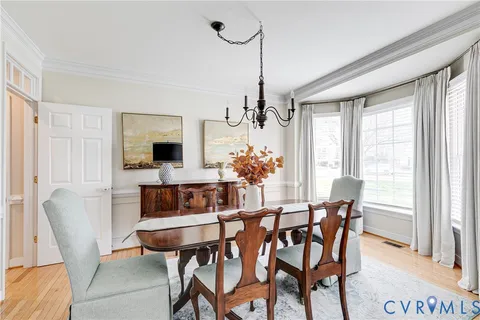 a view of a dining room with furniture and window