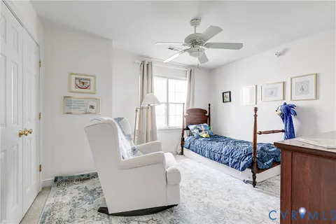 a bedroom with a bed and a couch