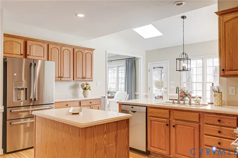 a kitchen with stainless steel appliances a sink stove and cabinets