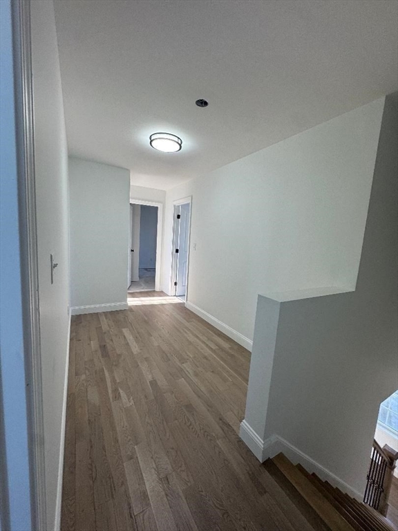 917 Dwelly Street Fall River, MA 02724 - Photo 14 of 22 a view of an empty room with wooden floor