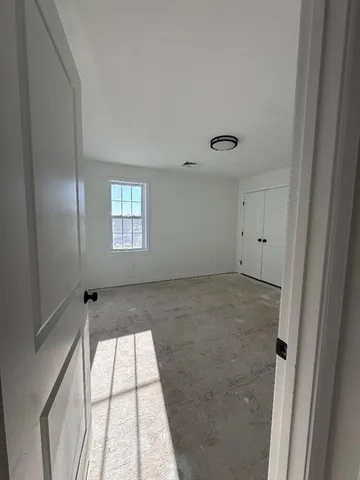 a view of empty room with windows