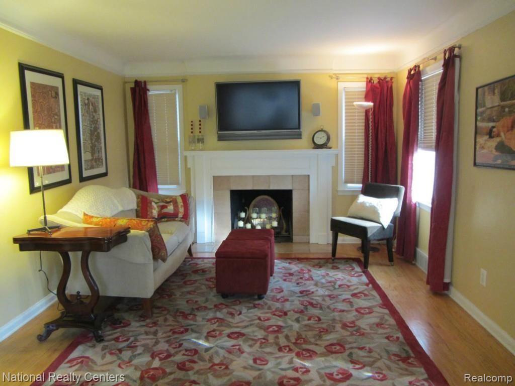 Living Room with Fireplace and mounted flat screen