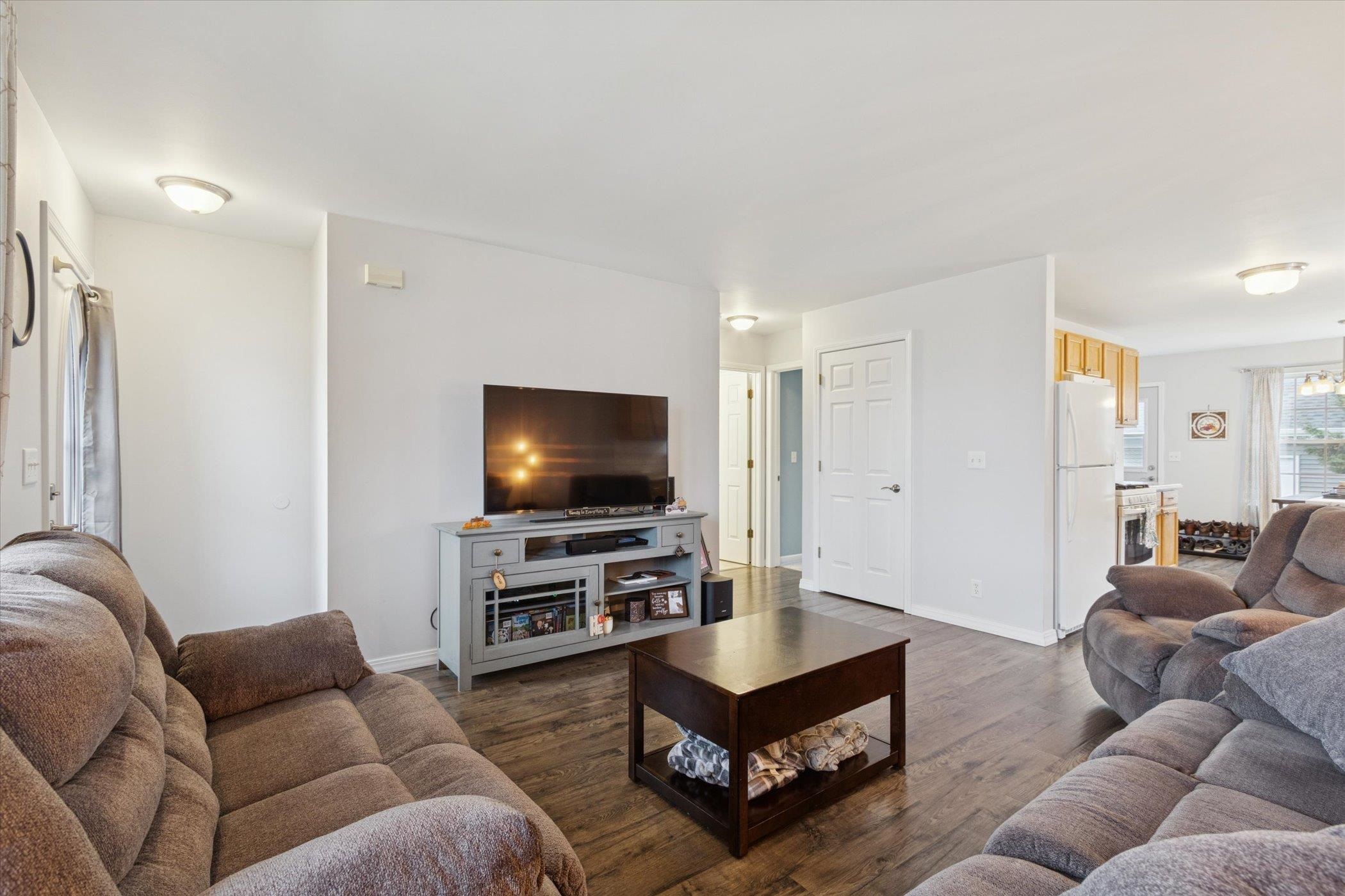 718 West Prospect Street Kirkland, IL 60146 - Photo 15 of 41 a living room with furniture and a flat screen tv