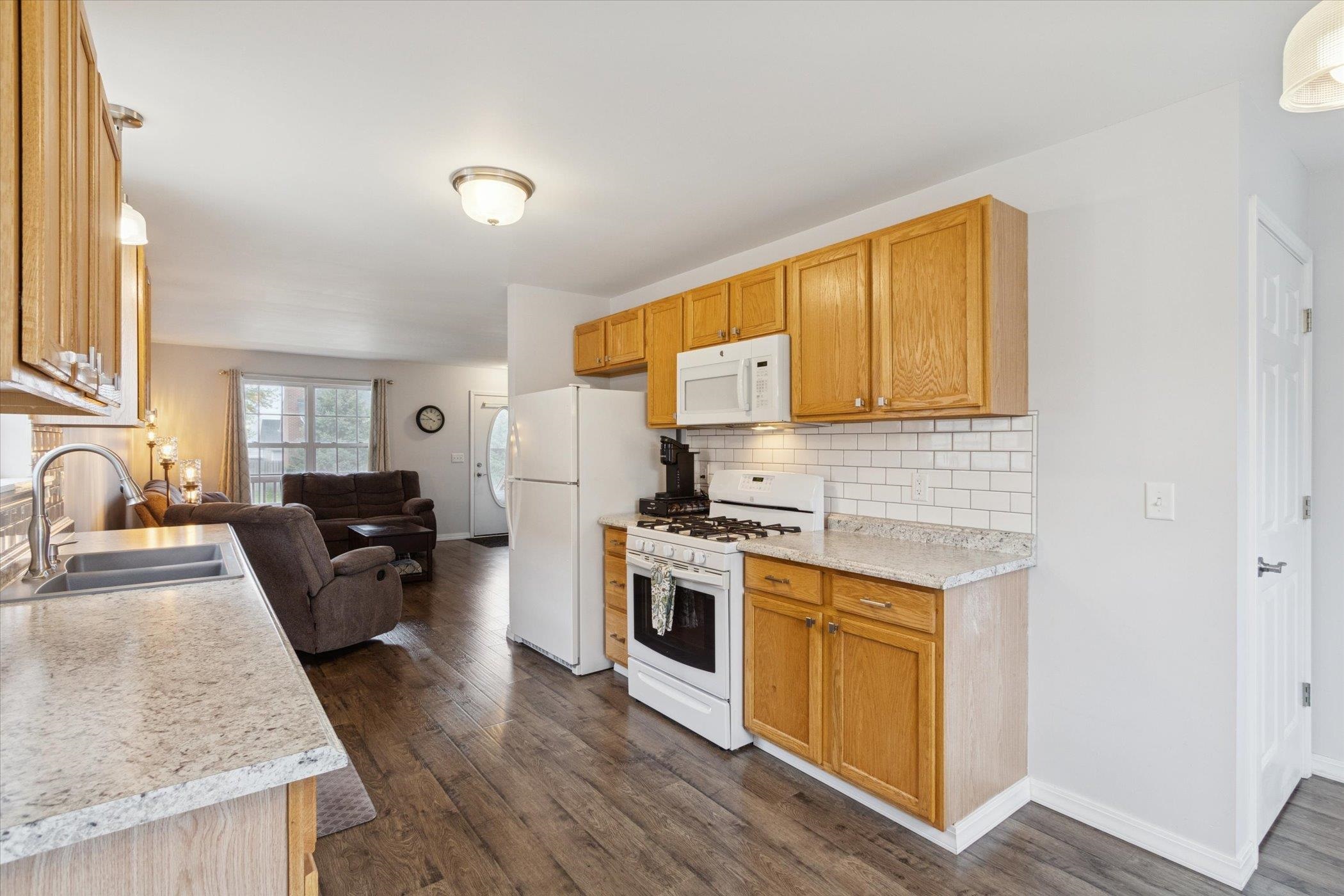 718 West Prospect Street Kirkland, IL 60146 - Photo 17 of 41 a kitchen with a stove a sink and a refrigerator