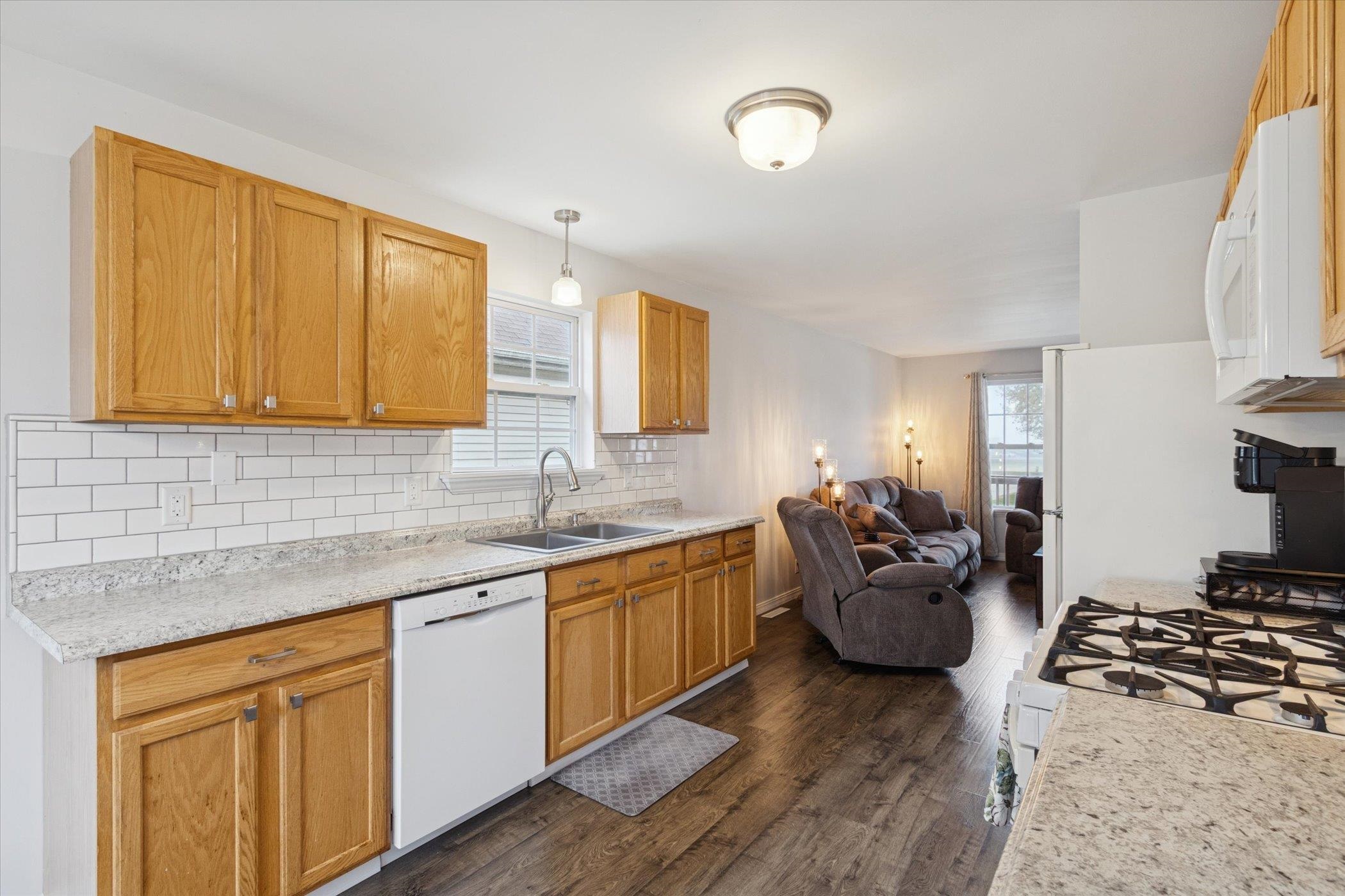 718 West Prospect Street Kirkland, IL 60146 - Photo 18 of 41 a kitchen with stainless steel appliances granite countertop sink stove top oven and cabinets