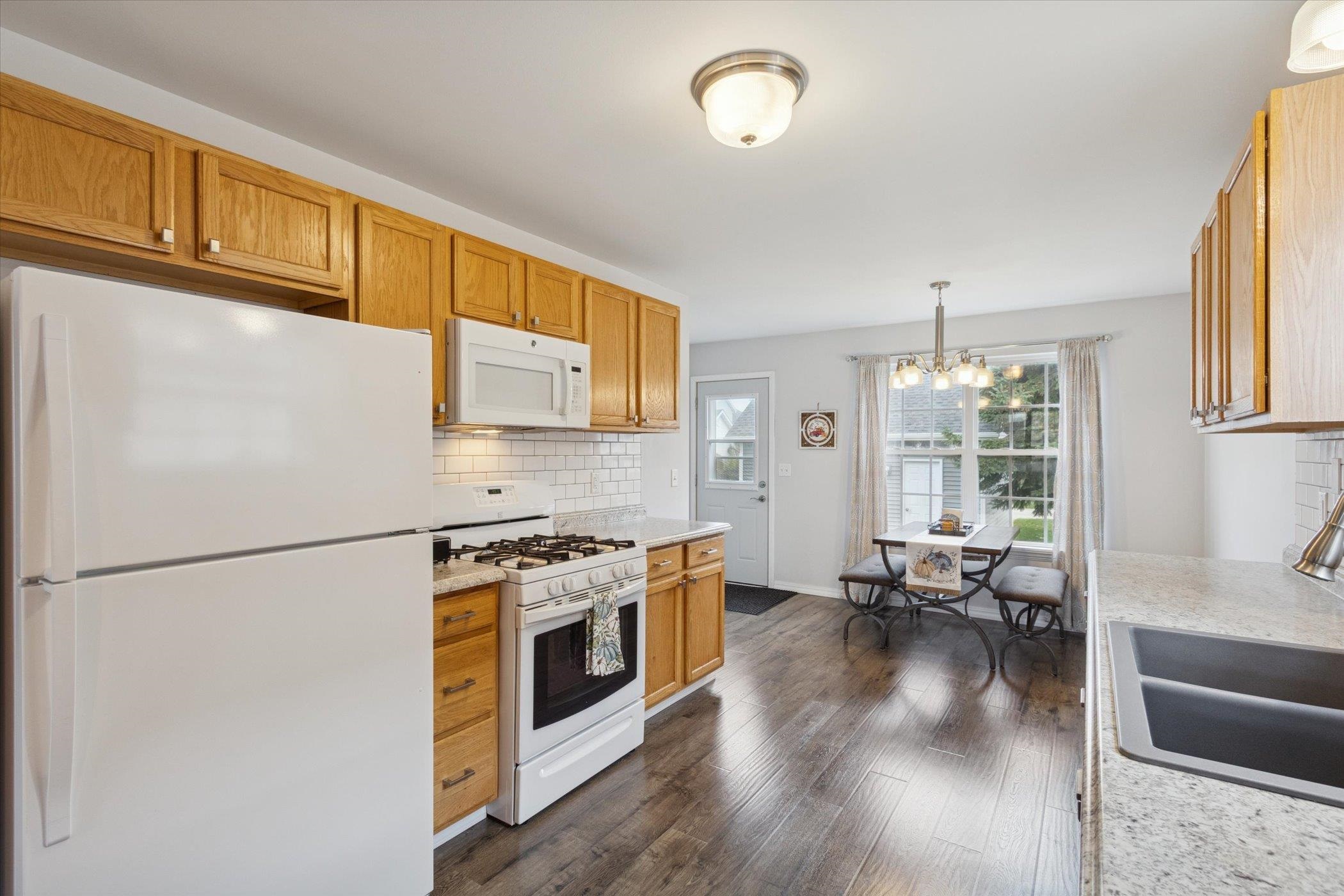 718 West Prospect Street Kirkland, IL 60146 - Photo 19 of 41 a kitchen with stainless steel appliances granite countertop a refrigerator a stove a sink dishwasher and a refrigerator