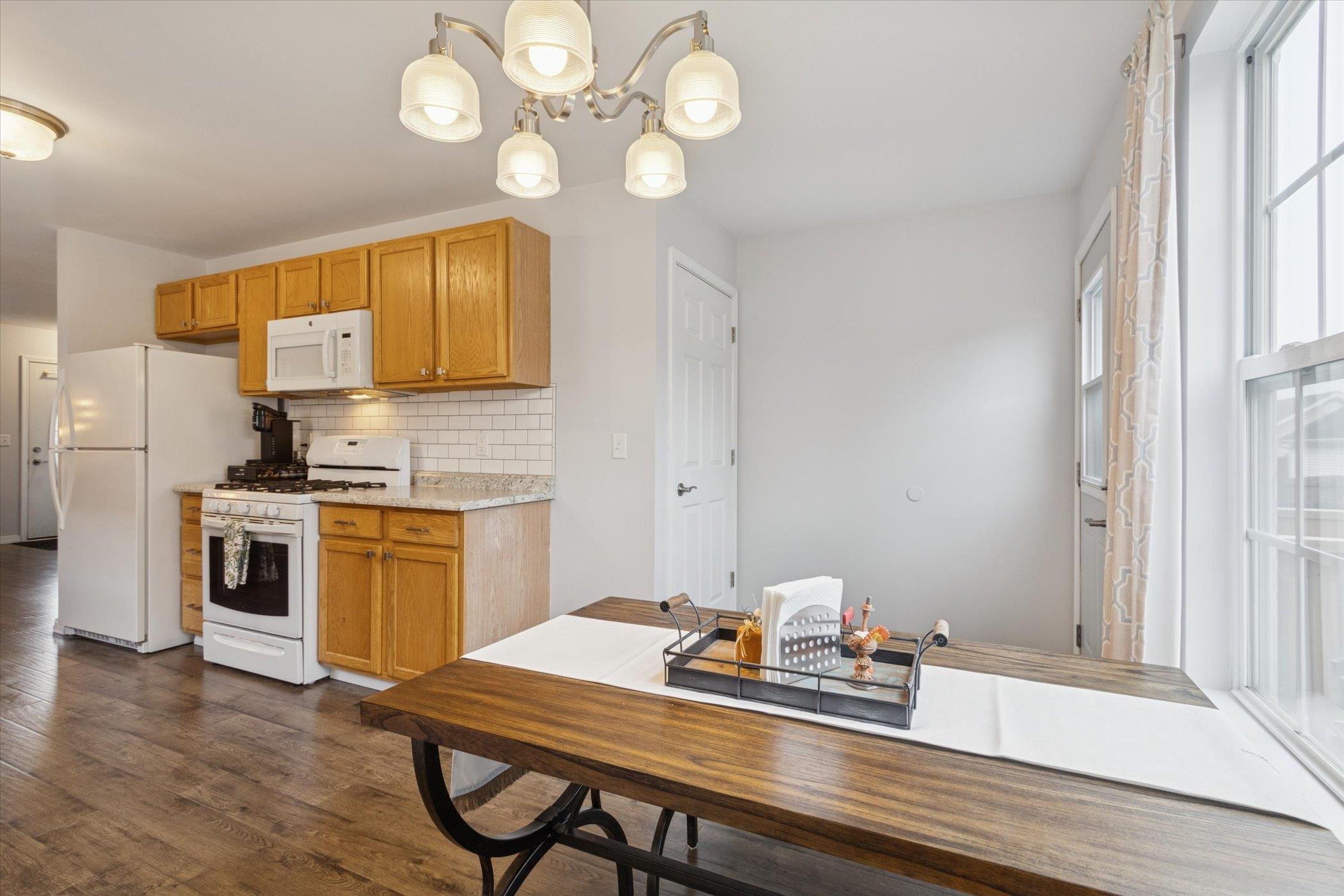718 West Prospect Street Kirkland, IL 60146 - Photo 20 of 41 a kitchen with a table chairs and cabinets