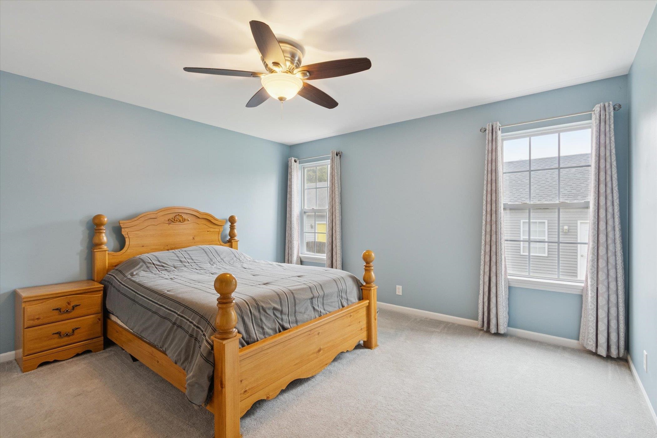 718 West Prospect Street Kirkland, IL 60146 - Photo 22 of 41 a bedroom with a bed and a chandelier