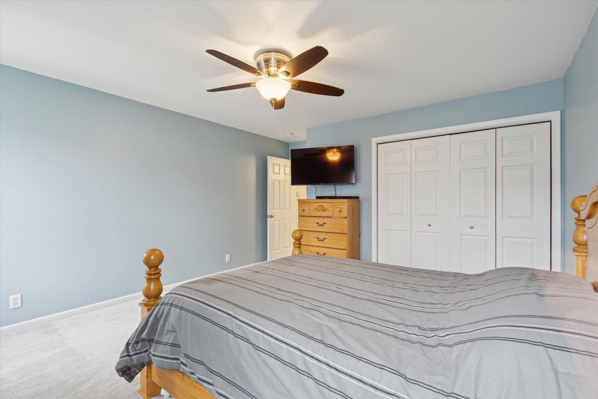 718 West Prospect Street Kirkland, IL 60146 - Photo 23 of 41 a bedroom with a bed and a chandelier