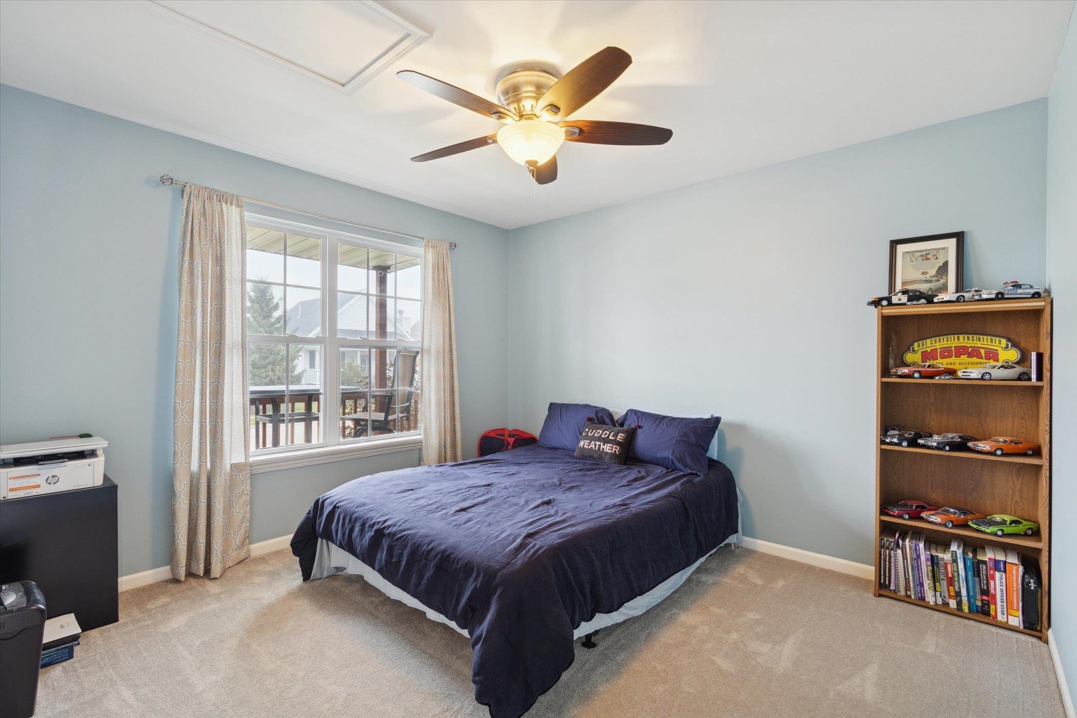 718 West Prospect Street Kirkland, IL 60146 - Photo 24 of 41 a bed sitting in a bedroom next to a window