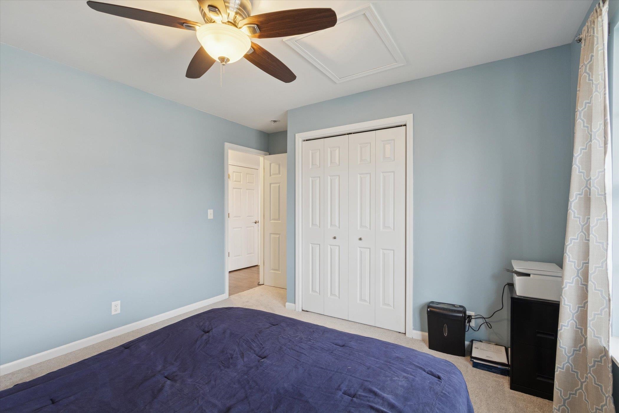718 West Prospect Street Kirkland, IL 60146 - Photo 25 of 41 a bedroom with a bed and a chandelier