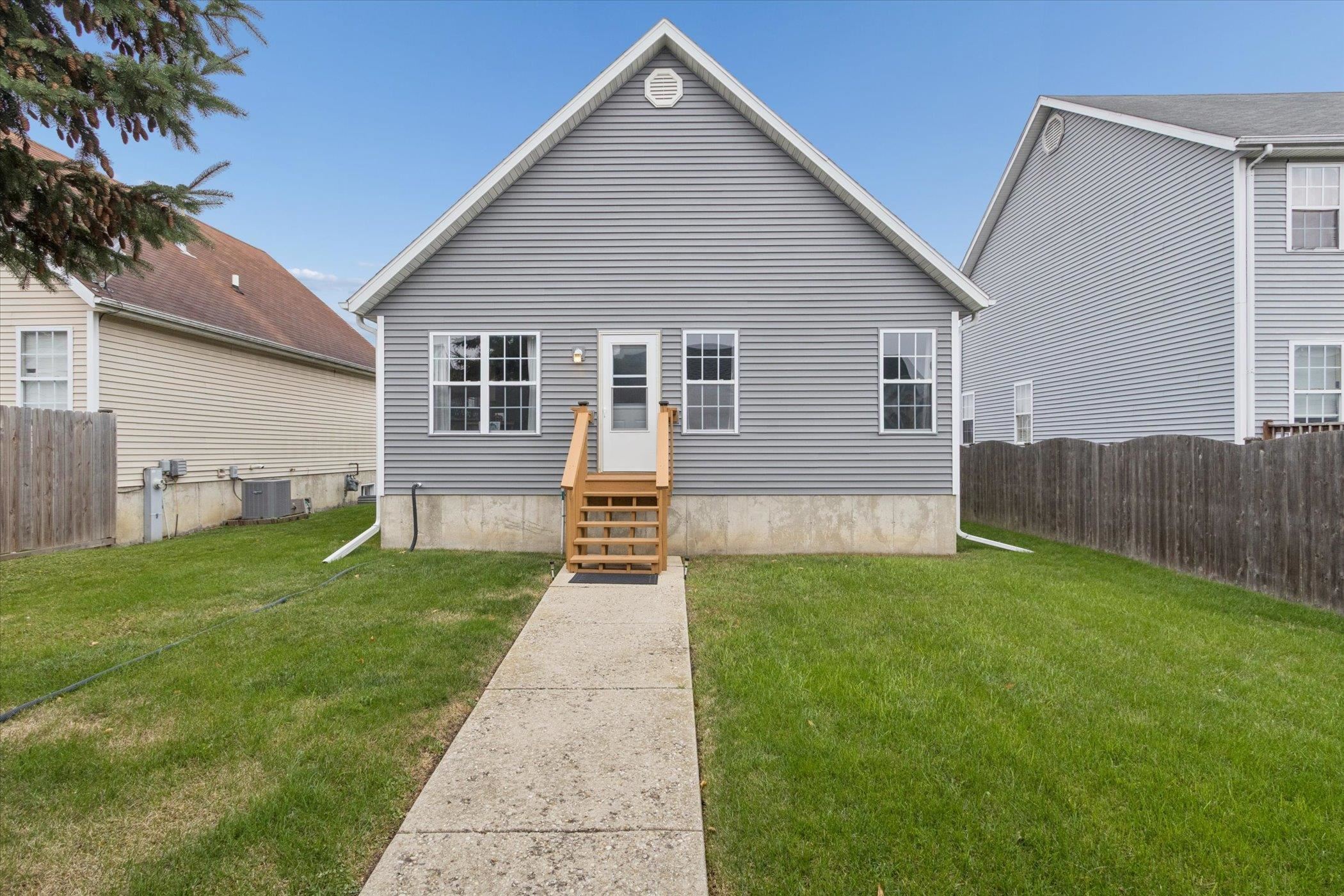 718 West Prospect Street Kirkland, IL 60146 - Photo 34 of 41 a view of a house with a yard and porch