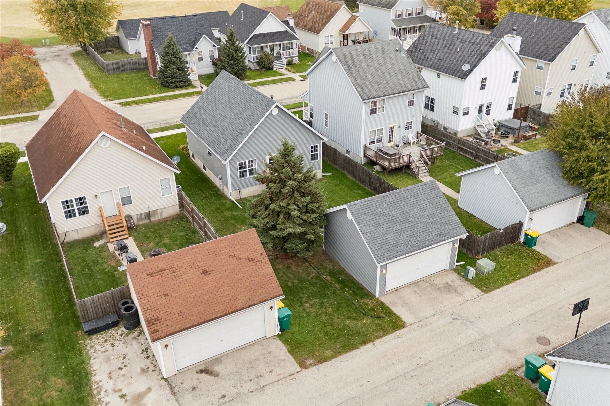 718 West Prospect Street Kirkland, IL 60146 - Photo 5 of 41 an aerial view of a house with garden space and a street view