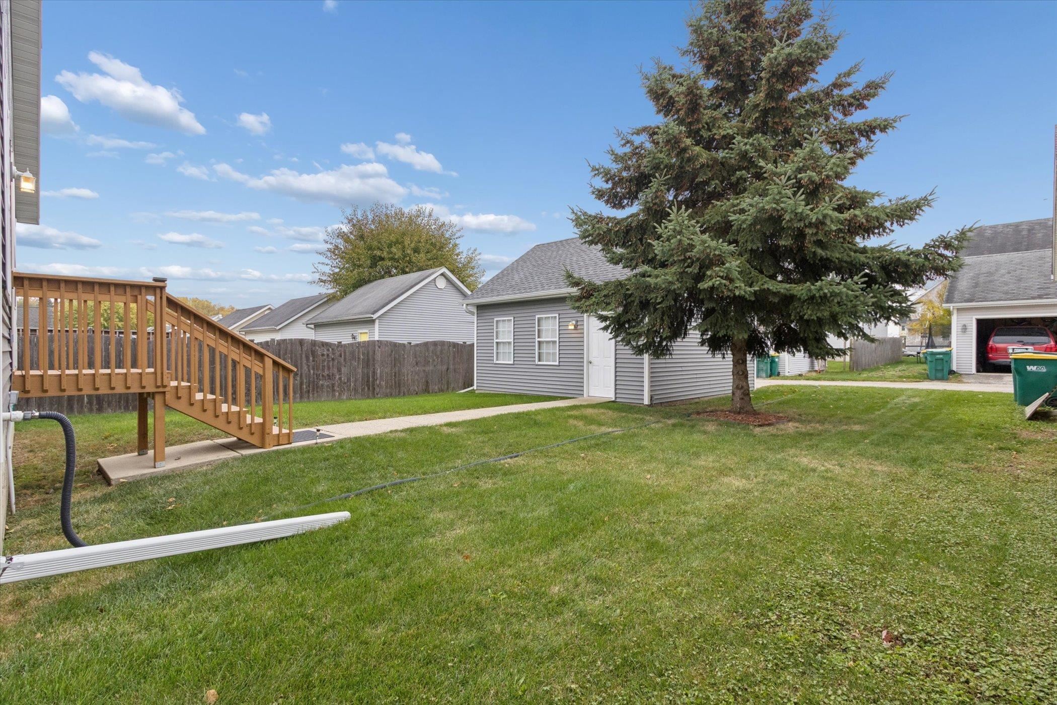 718 West Prospect Street Kirkland, IL 60146 - Photo 7 of 41 a view of a house with a yard