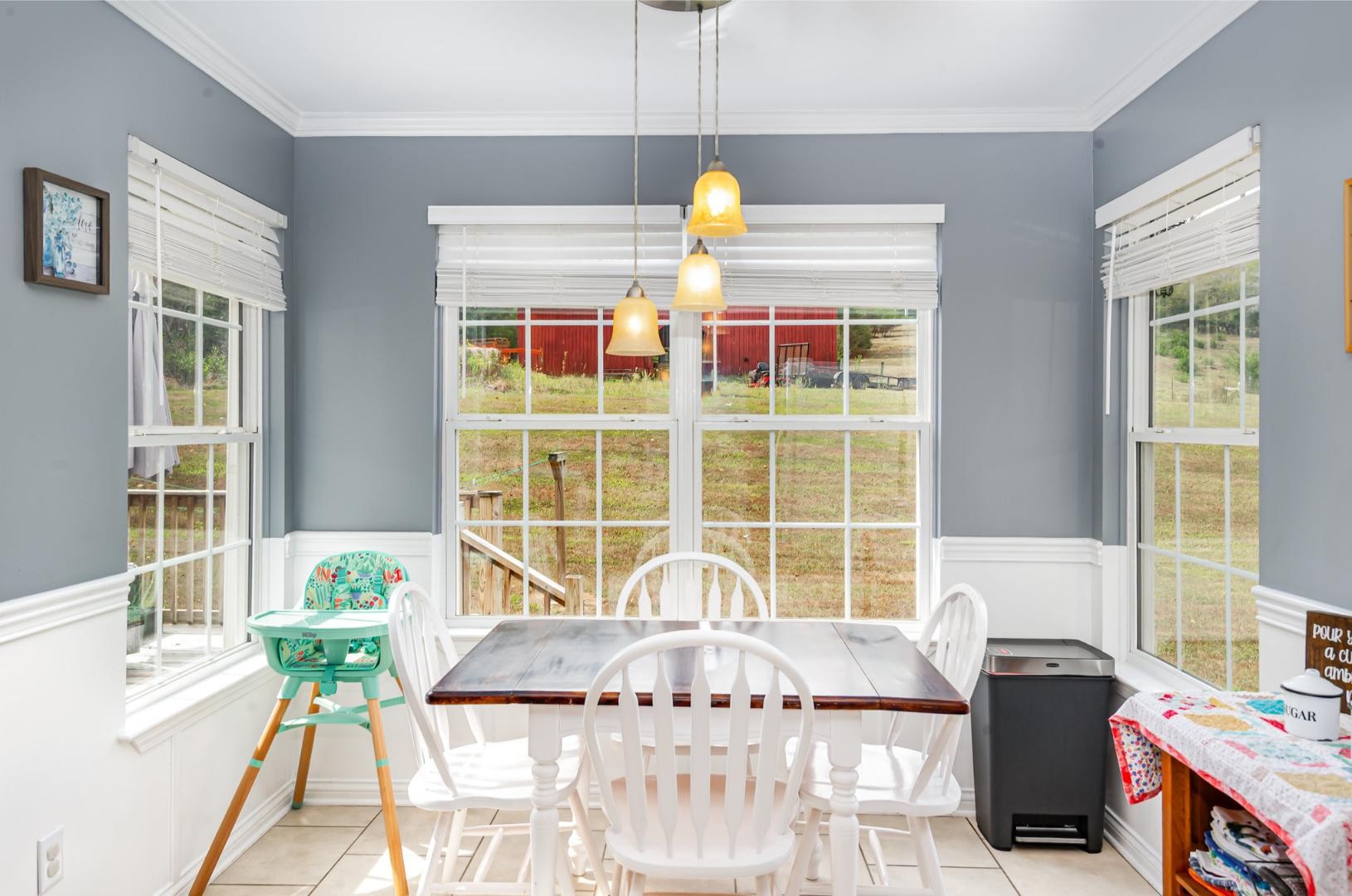 879 Rock Bridge Road Bethpage, TN 37022 - Photo 11 of 39 a view of a dining room with furniture a chandelier and large windows