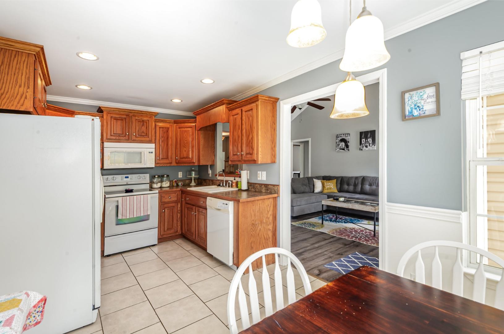879 Rock Bridge Road Bethpage, TN 37022 - Photo 13 of 39 a kitchen with stainless steel appliances granite countertop a refrigerator a stove top oven a sink and dishwasher