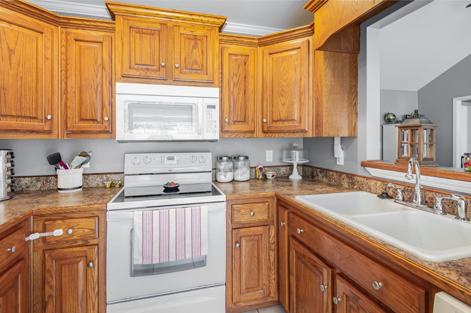 879 Rock Bridge Road Bethpage, TN 37022 - Photo 15 of 39 a kitchen with stainless steel appliances granite countertop a sink stove and cabinets