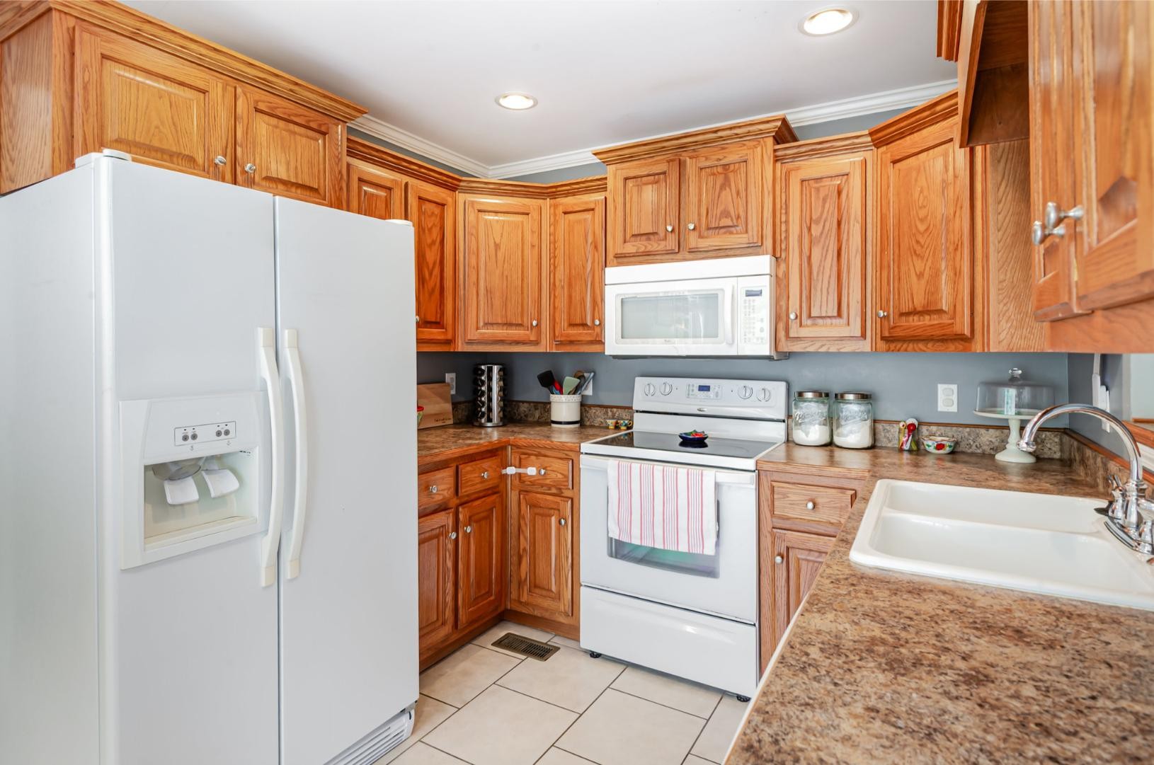 879 Rock Bridge Road Bethpage, TN 37022 - Photo 16 of 39 a kitchen with stainless steel appliances granite countertop a refrigerator sink and cabinets