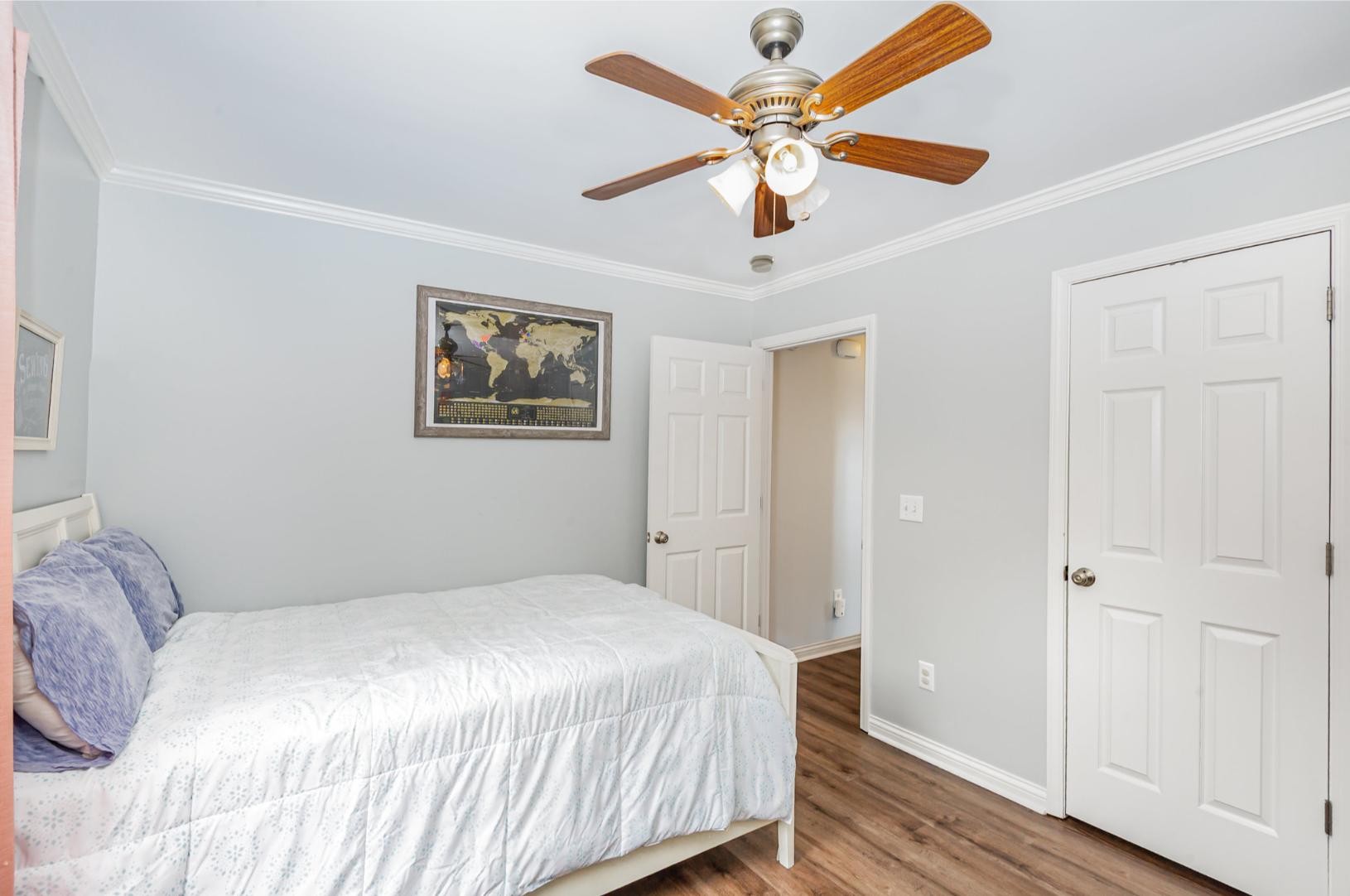 879 Rock Bridge Road Bethpage, TN 37022 - Photo 24 of 39 a bedroom with a large bed chandelier and a window