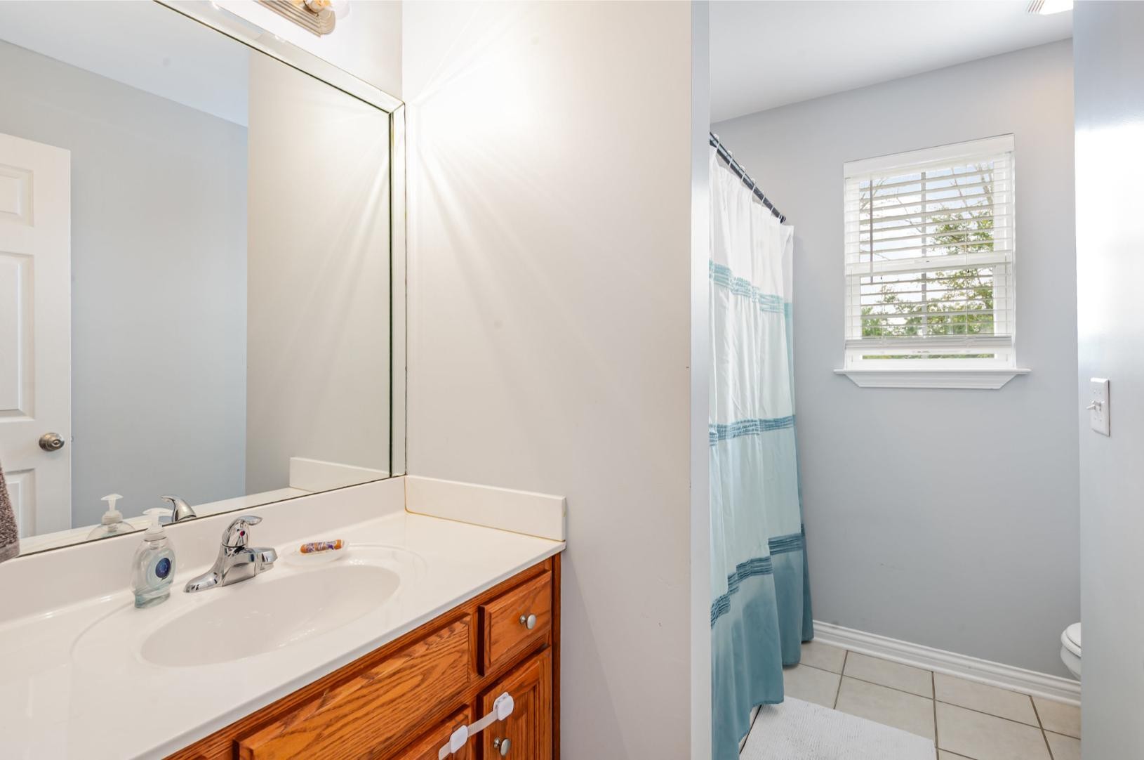 879 Rock Bridge Road Bethpage, TN 37022 - Photo 27 of 39 a bathroom with a sink and a mirror