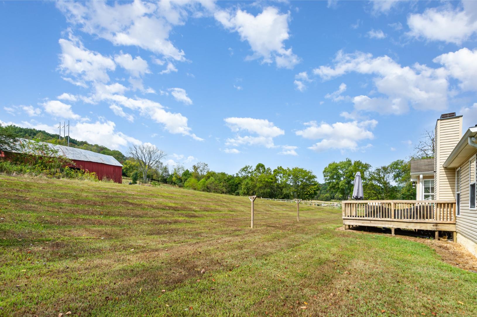 879 Rock Bridge Road Bethpage, TN 37022 - Photo 5 of 39 a view of a lake with houses in the background
