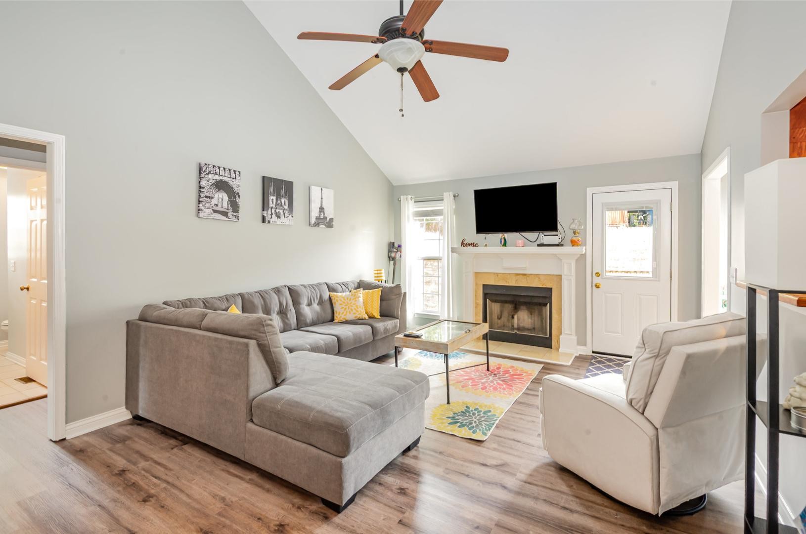 879 Rock Bridge Road Bethpage, TN 37022 - Photo 8 of 39 a living room with furniture a flat screen tv and a fireplace