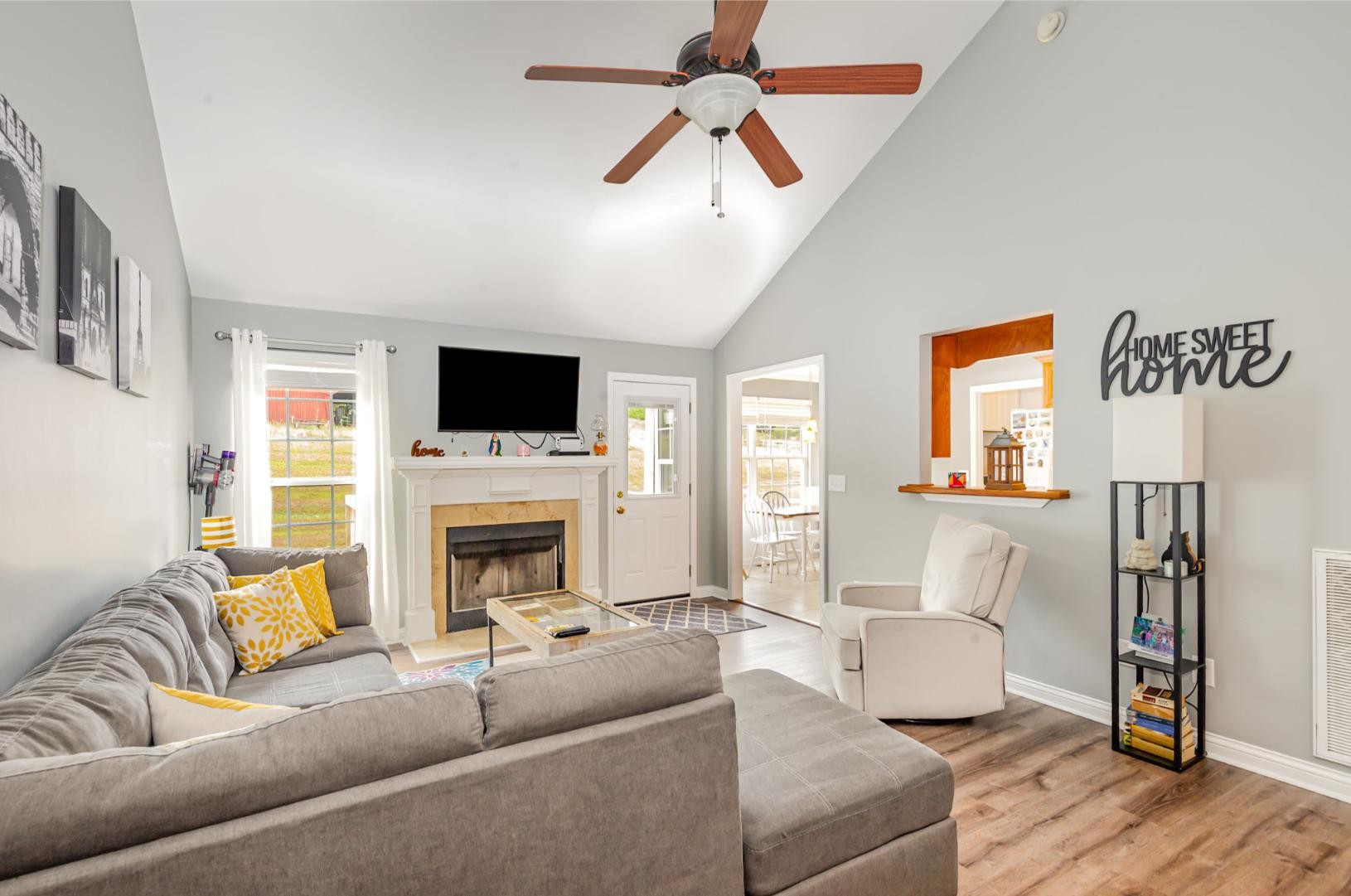 879 Rock Bridge Road Bethpage, TN 37022 - Photo 9 of 39 a living room with furniture a fireplace and a flat screen tv