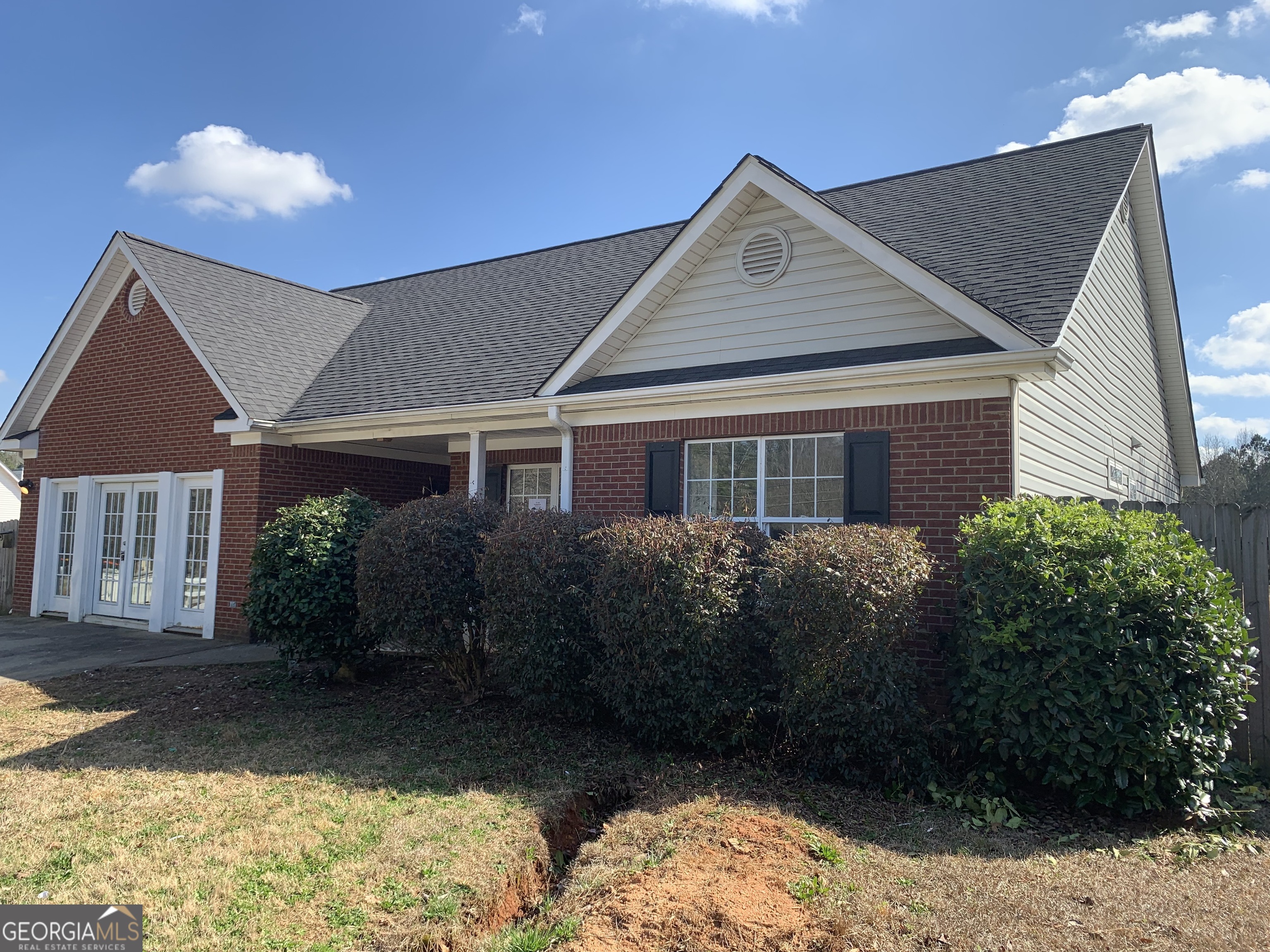 a front view of a house with a yard