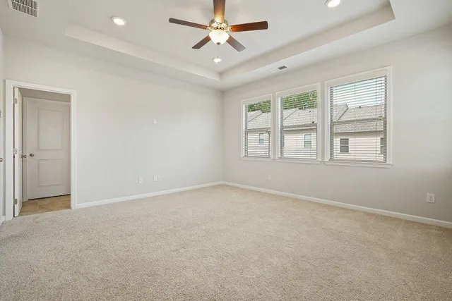a bathroom with a shower a sink and a mirror