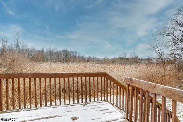 a view of a wooden street and lake
