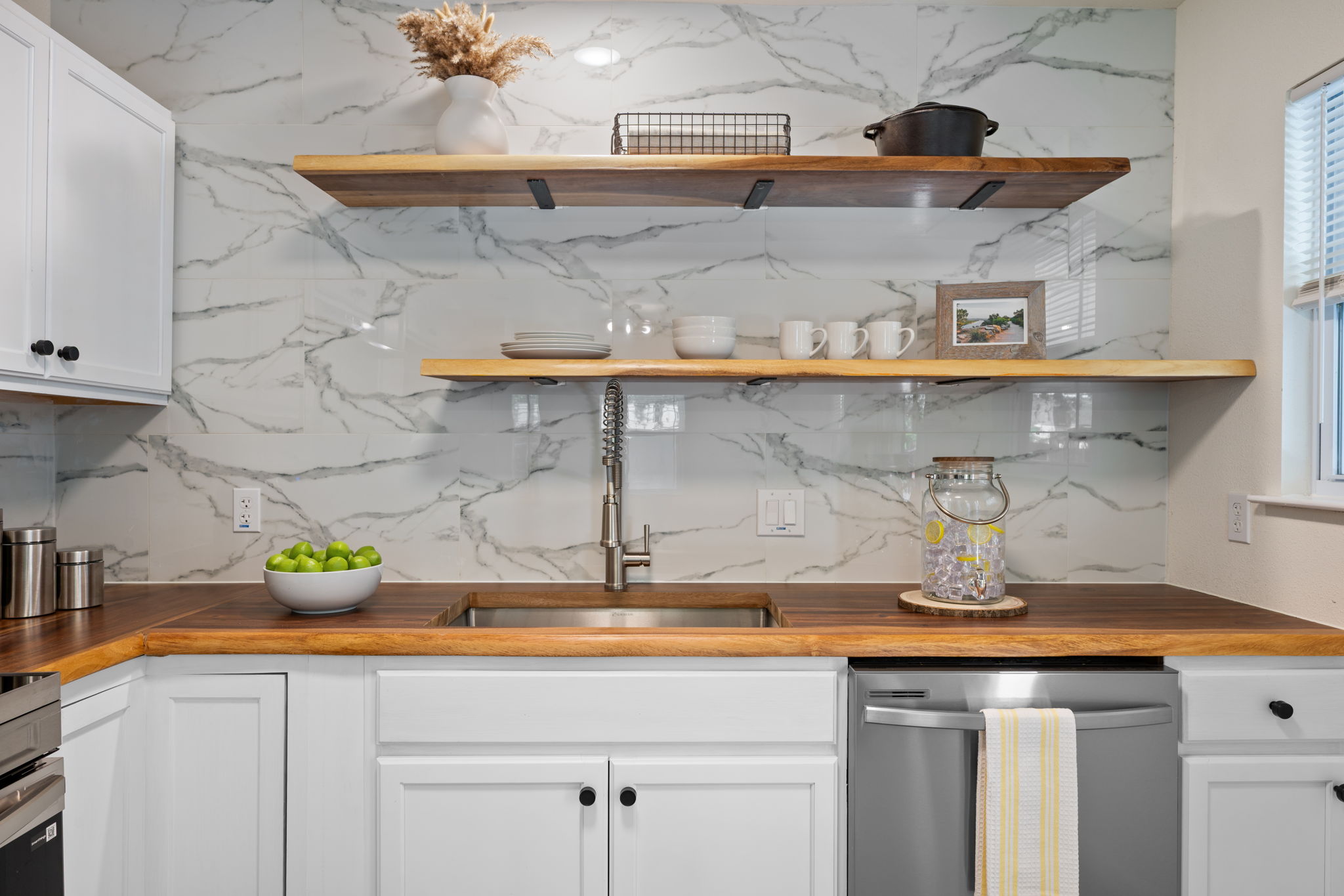 4711 Bandera Road Austin, TX 78721 - Photo 1 of 22 a kitchen with a sink and cabinets