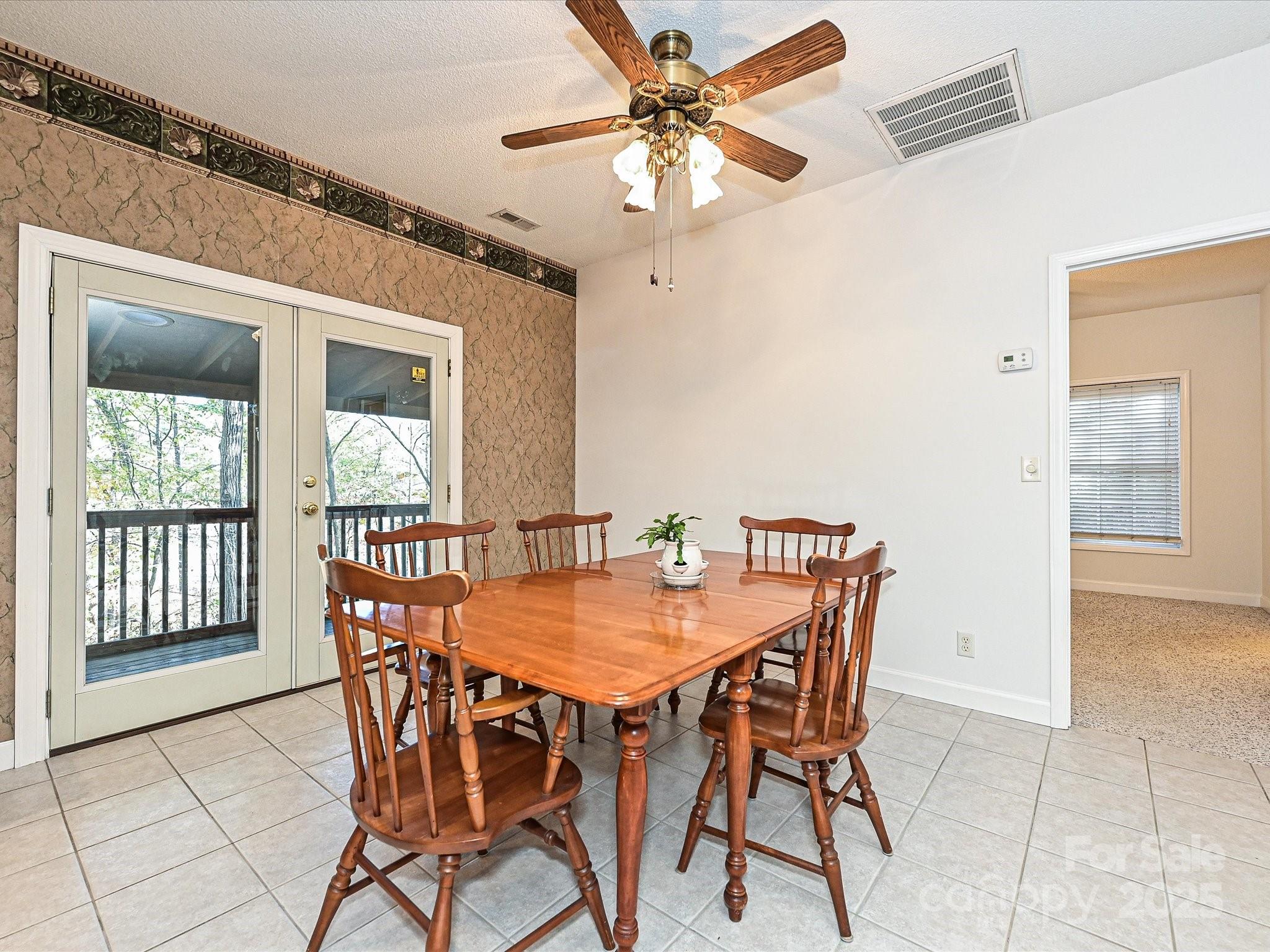 25040 Timberlake Drive Tega Cay, SC 29708 - Photo 15 of 40 a view of a dining room with furniture and window