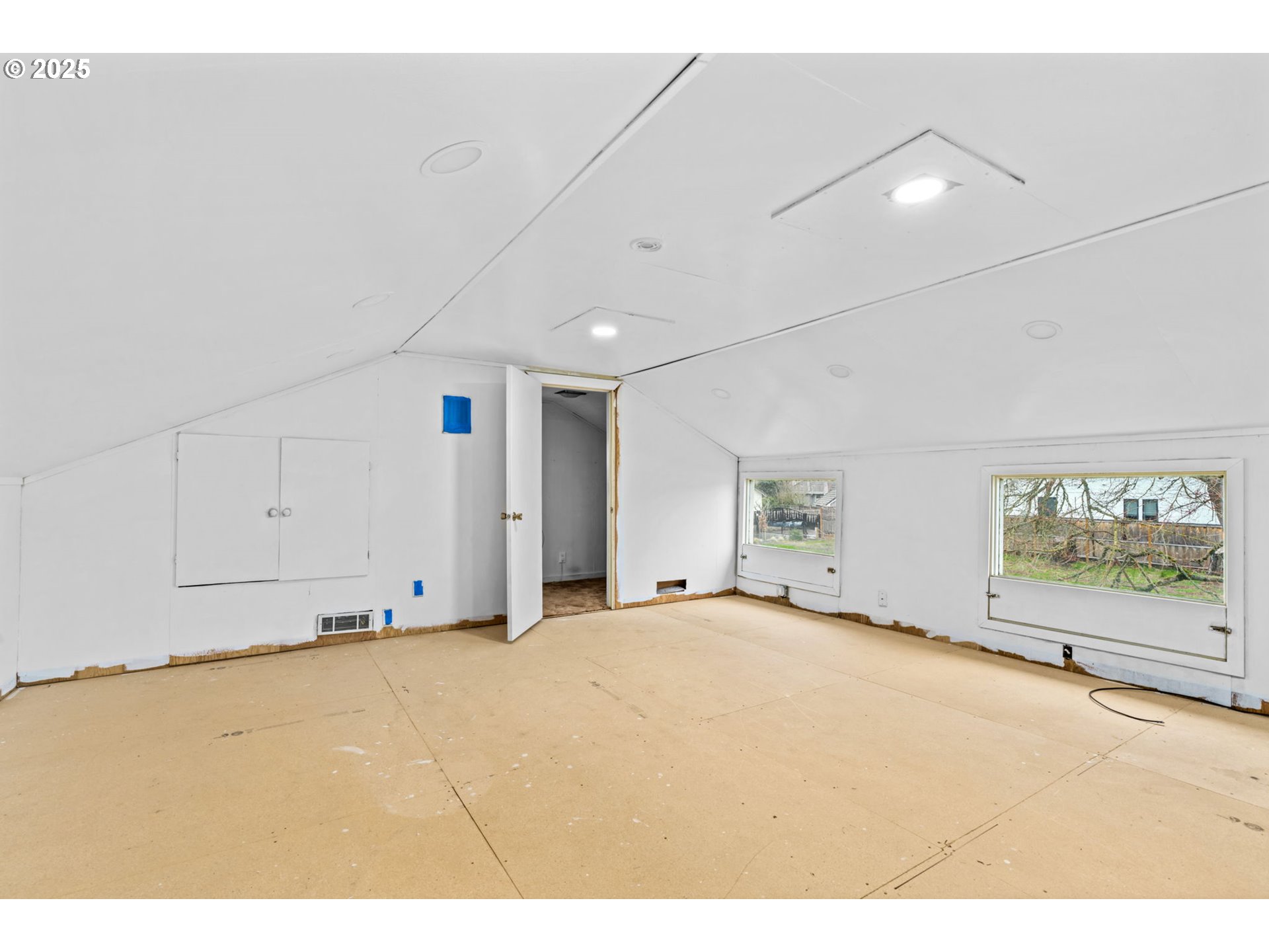 135 Ayres Road Eugene, OR 97408 - Photo 12 of 32 a view of an empty room with a window