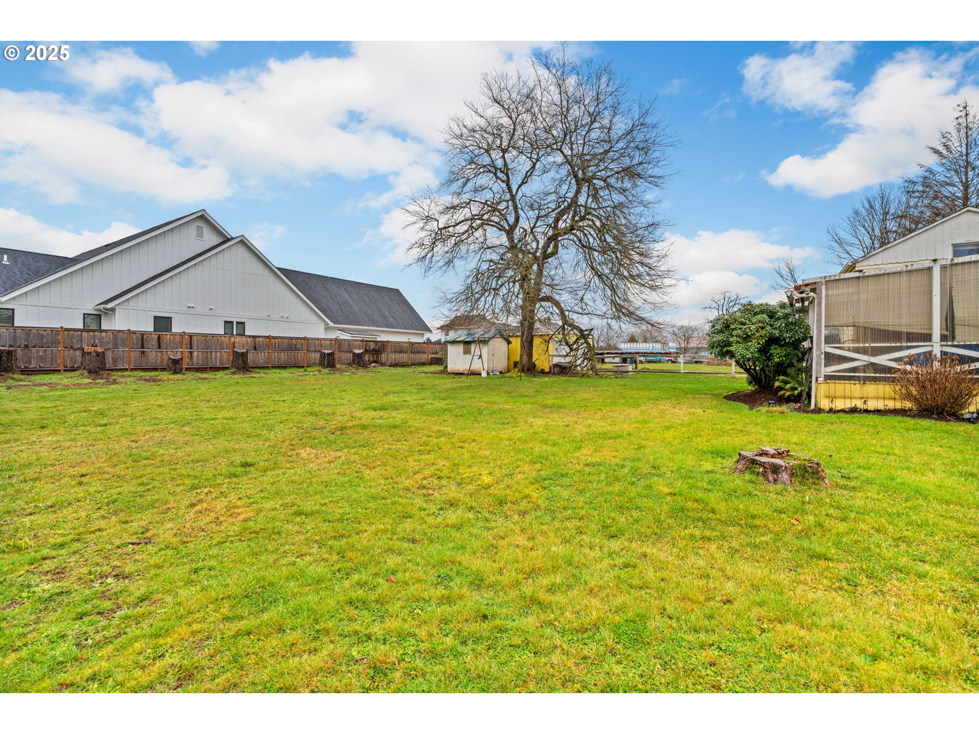 135 Ayres Road Eugene, OR 97408 - Photo 23 of 32 a view of a large pool with lawn chairs under an umbrella