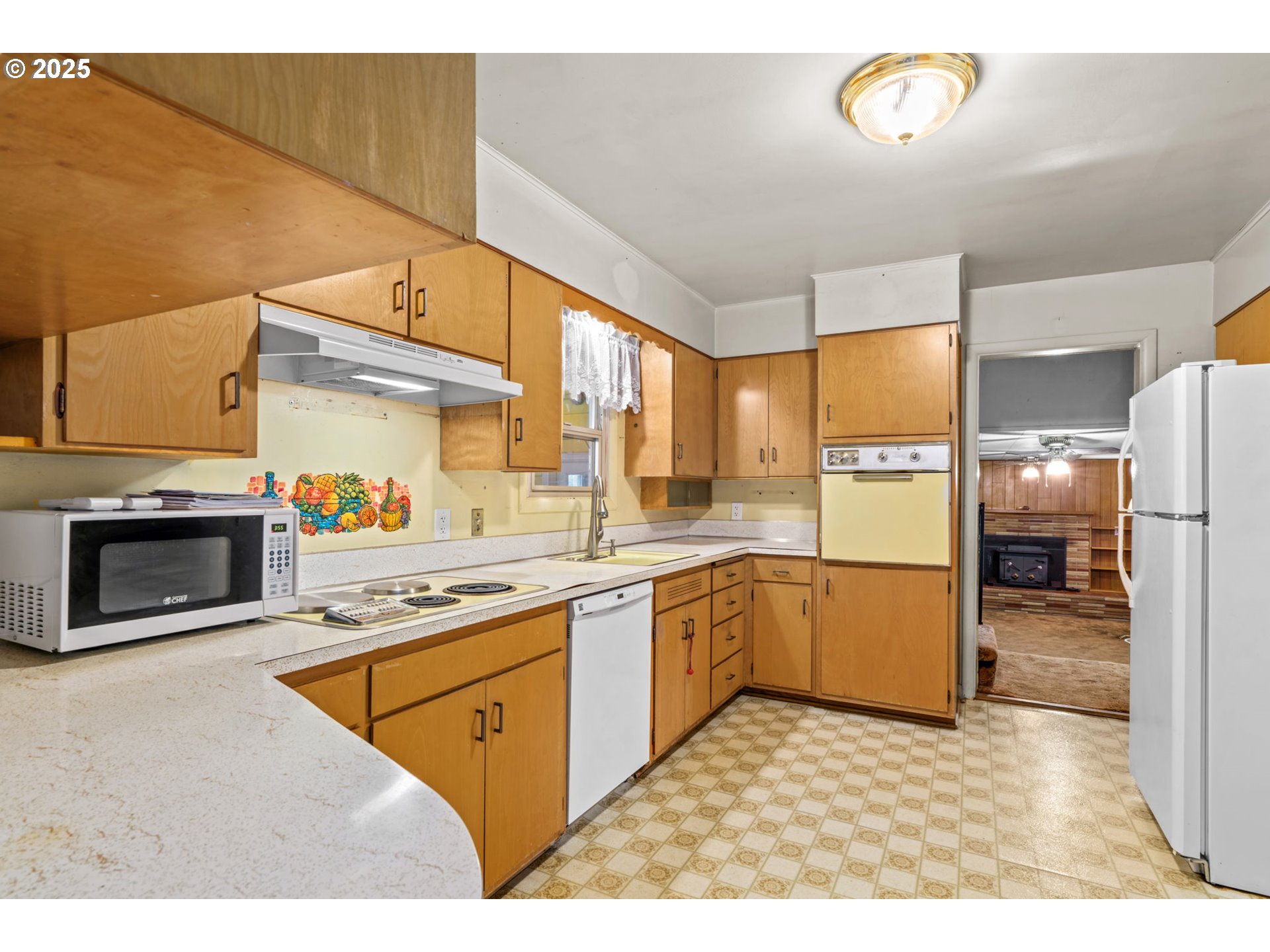 135 Ayres Road Eugene, OR 97408 - Photo 9 of 32 a kitchen with stainless steel appliances granite countertop a stove a sink and a refrigerator