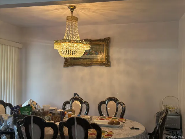 a front view of a house with glass top table and chairs