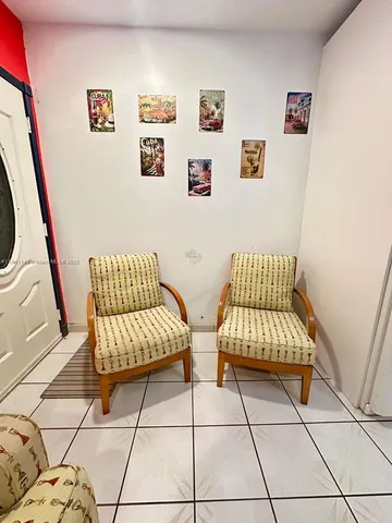 a living room with a couch and a next to a window