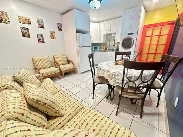 a living room with furniture and a rug