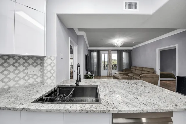 a kitchen with a stove and a sink